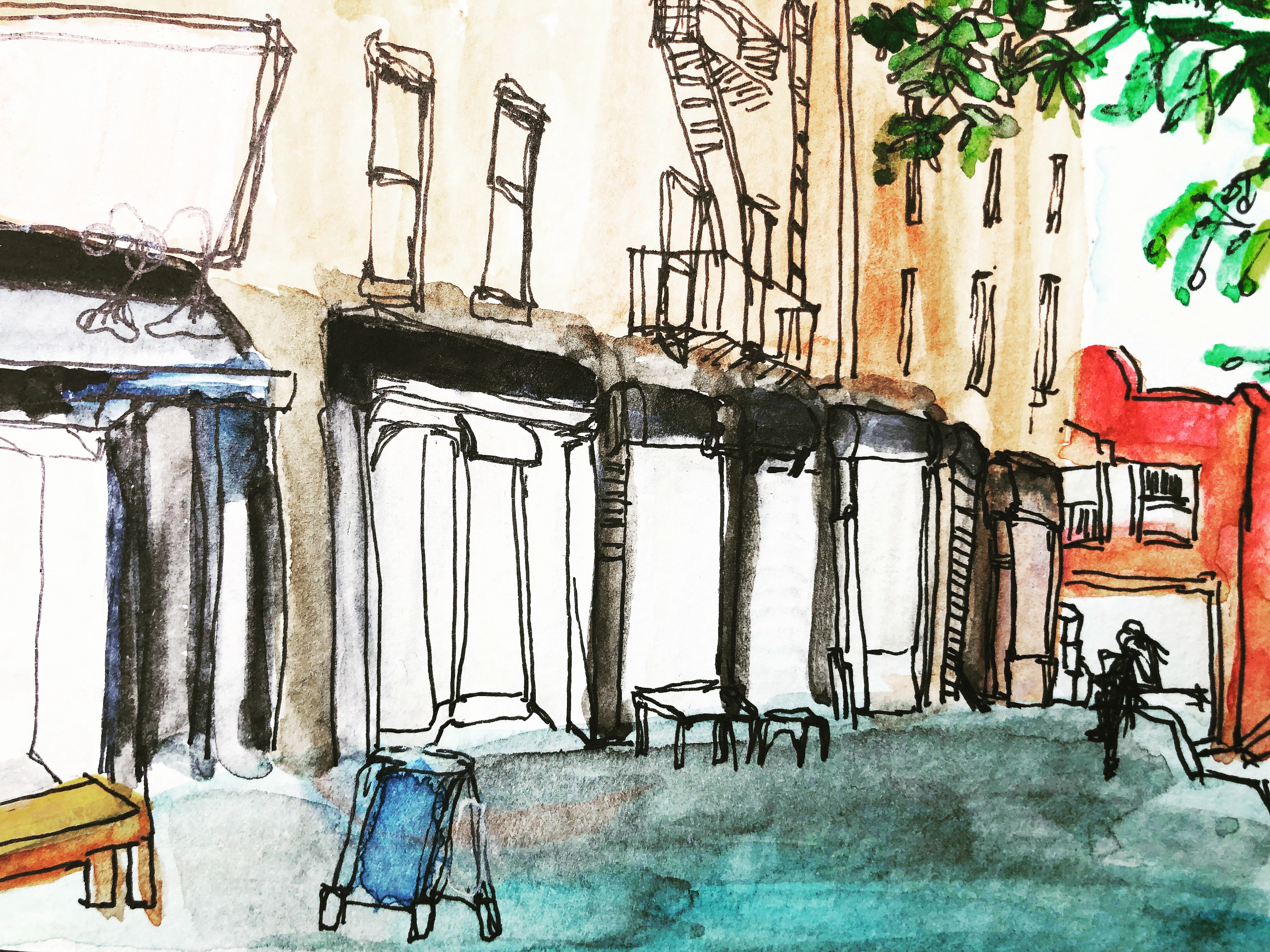 Ink and watercolor pen drawing of a neighborhood street of storefronts.