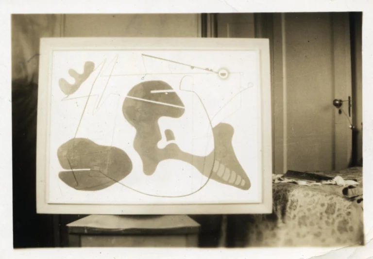 A sepia-toned photograph of a an abstract oil painting consisting of biomorphic forms and organic, curved lines.