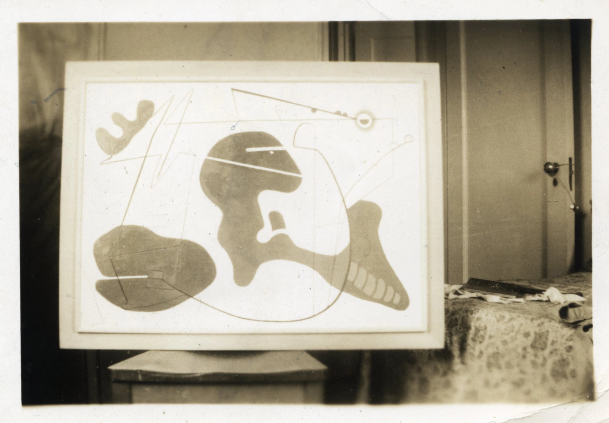 A sepia-toned photograph of a an abstract oil painting consisting of biomorphic forms and organic, curved lines.